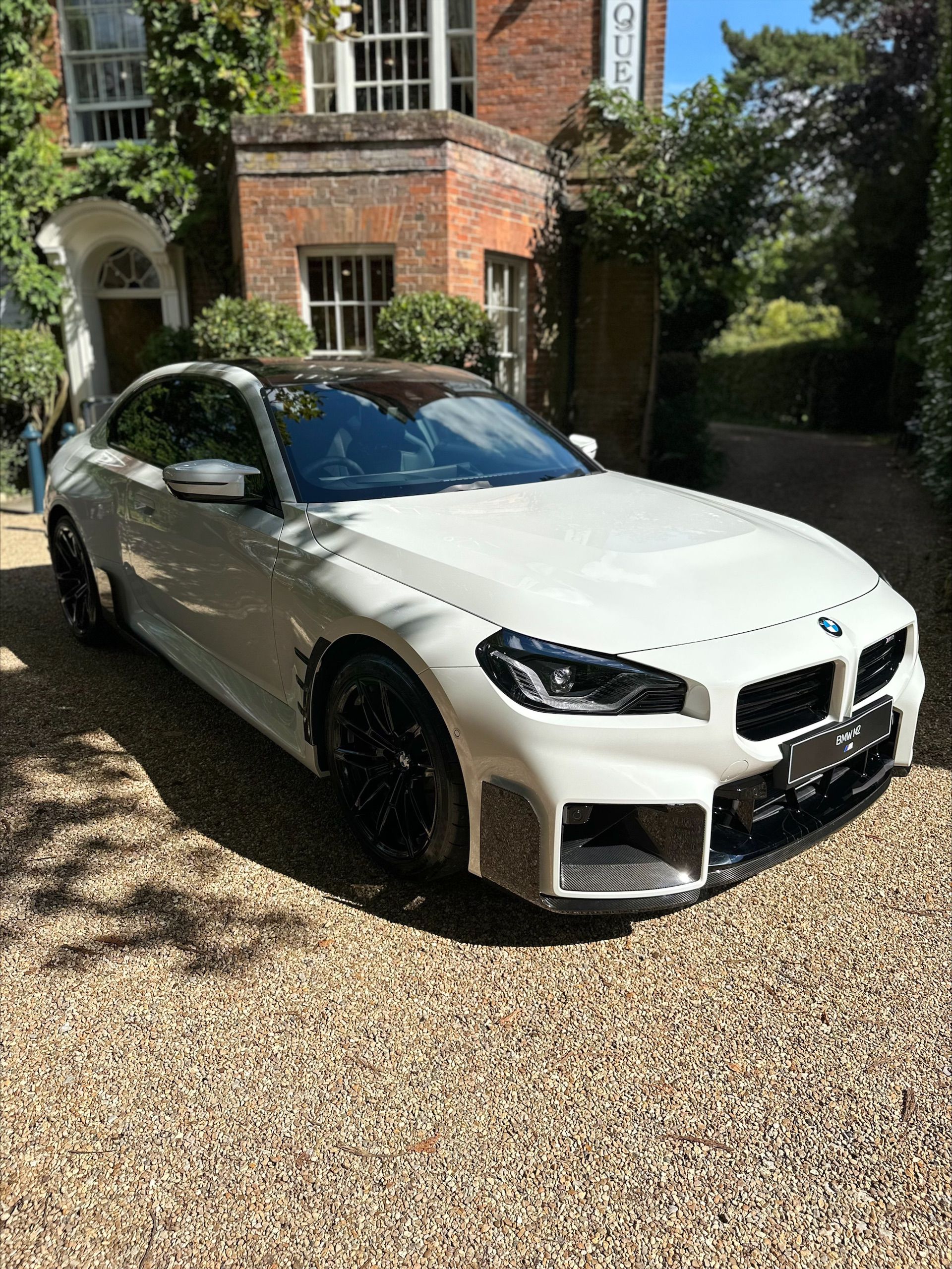 https://www.bmw-sg.com/wp-content/uploads/2023/08/Exploring-the-2023-BMW-M2-Alpine-White-With-M-Performance-Parts.jpeg